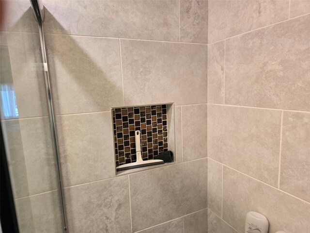 details featuring a tile shower