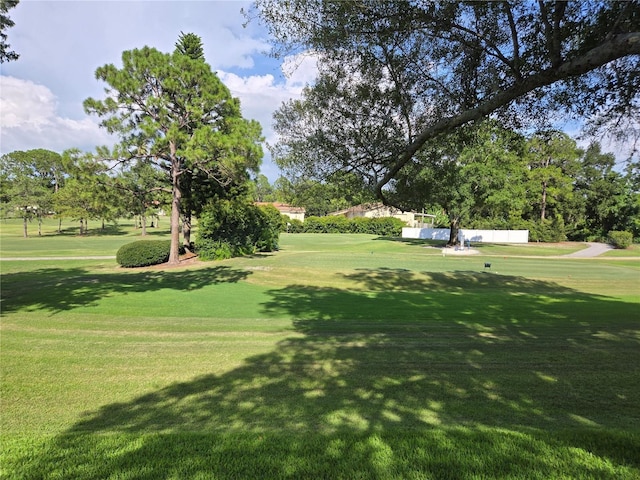 view of property's community with a lawn