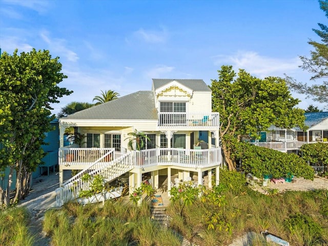 rear view of house with a balcony