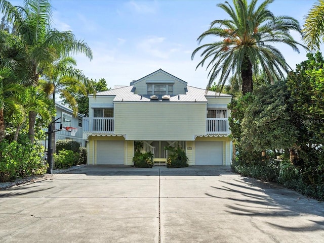 view of front of house with a garage and a balcony