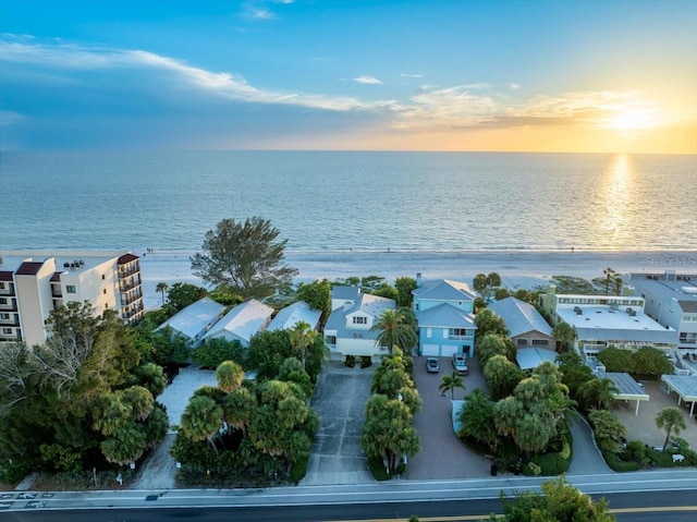 aerial view at dusk with a water view