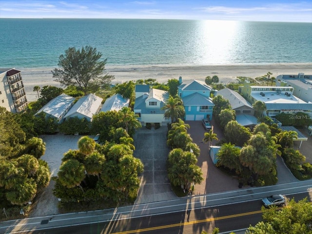 aerial view with a water view and a beach view