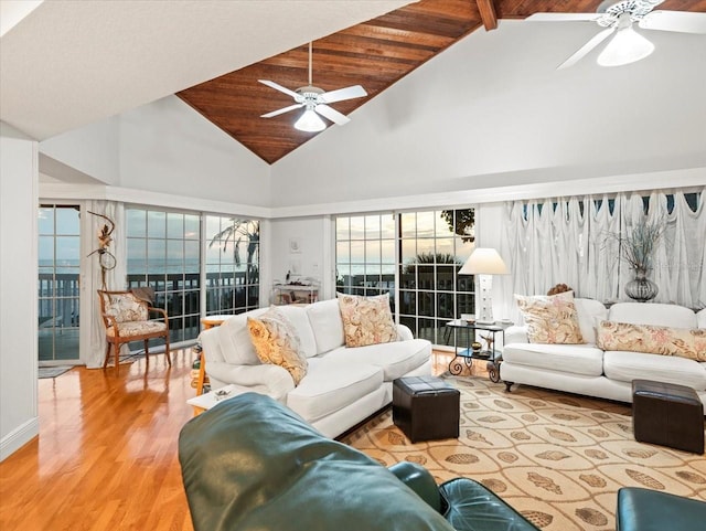 living room with light hardwood / wood-style flooring, wood ceiling, high vaulted ceiling, and ceiling fan