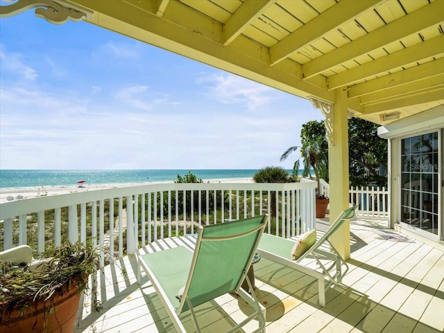 exterior space featuring a water view and a view of the beach