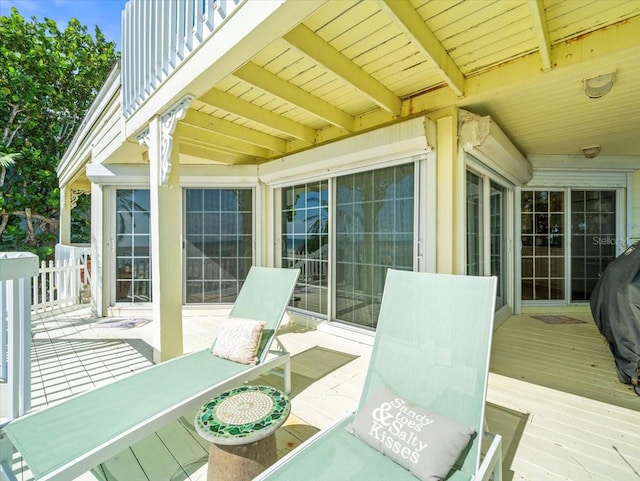 wooden terrace featuring area for grilling