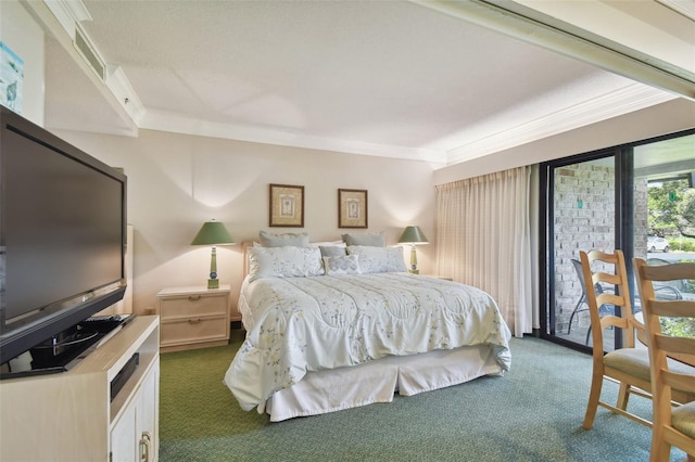 bedroom featuring crown molding and dark carpet