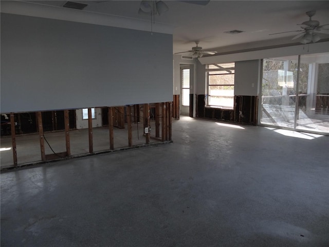 empty room featuring concrete flooring and ceiling fan