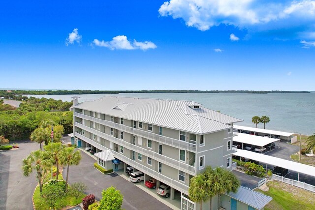 birds eye view of property with a water view