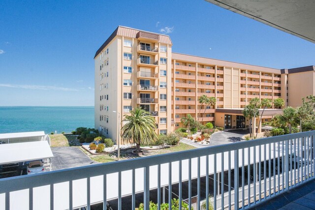 balcony featuring a water view