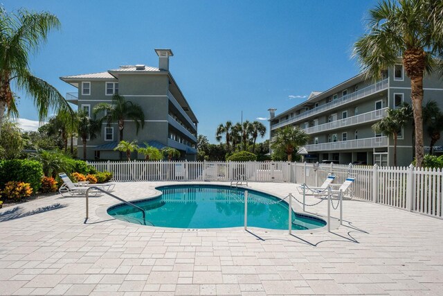 view of swimming pool with a patio