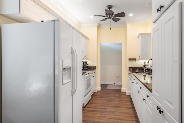 kitchen featuring ornamental molding, white appliances, ceiling fan, sink, and white cabinets