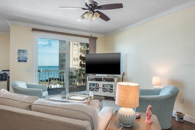 living room featuring wood-type flooring, ceiling fan, and ornamental molding