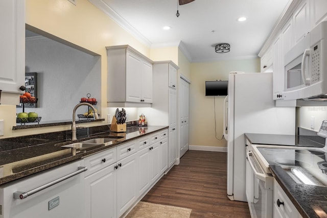 kitchen with white cabinetry, crown molding, white appliances, and sink