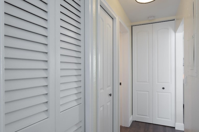 corridor featuring dark hardwood / wood-style flooring