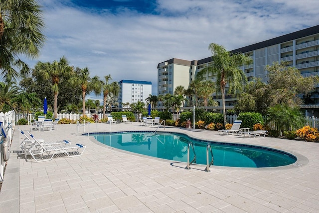 view of swimming pool with a patio area