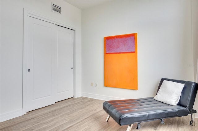 sitting room with light wood-type flooring