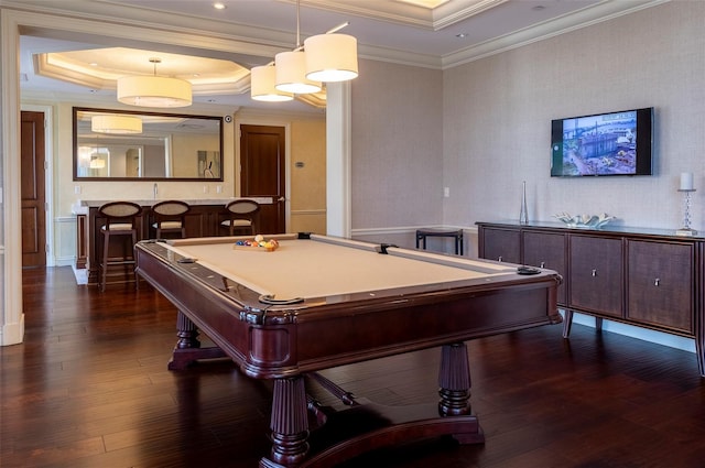 playroom with bar area, dark wood-type flooring, a tray ceiling, ornamental molding, and billiards