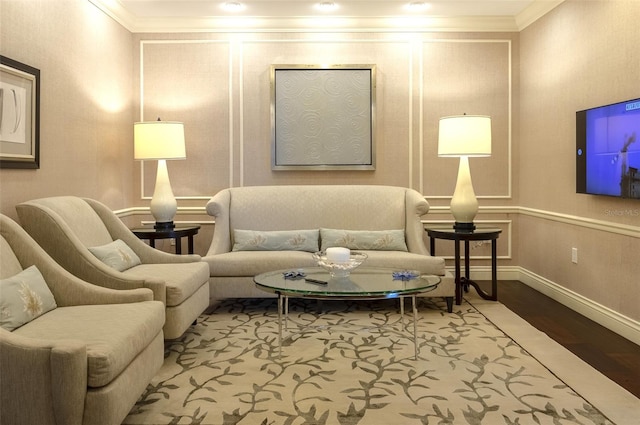 living room with crown molding and hardwood / wood-style floors