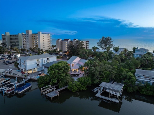 aerial view at dusk with a water view