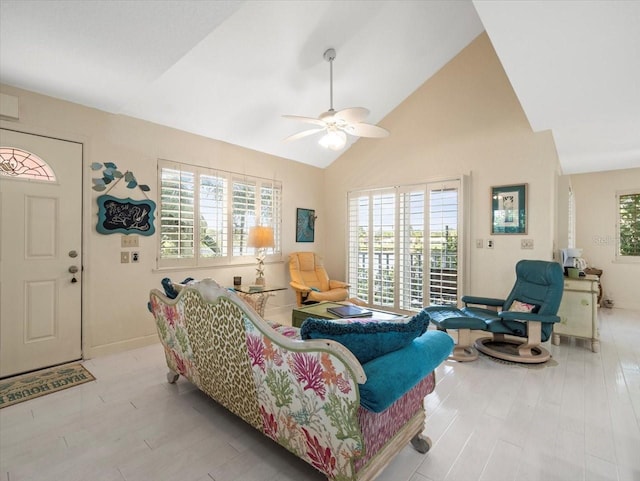 living room with lofted ceiling, light hardwood / wood-style floors, and ceiling fan