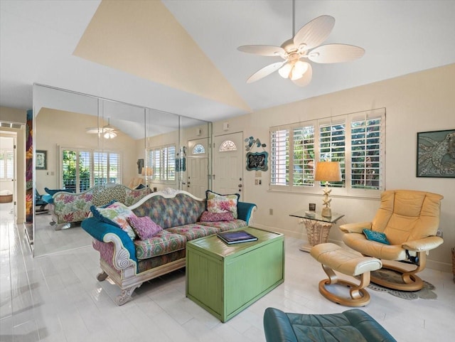 living room with lofted ceiling and ceiling fan