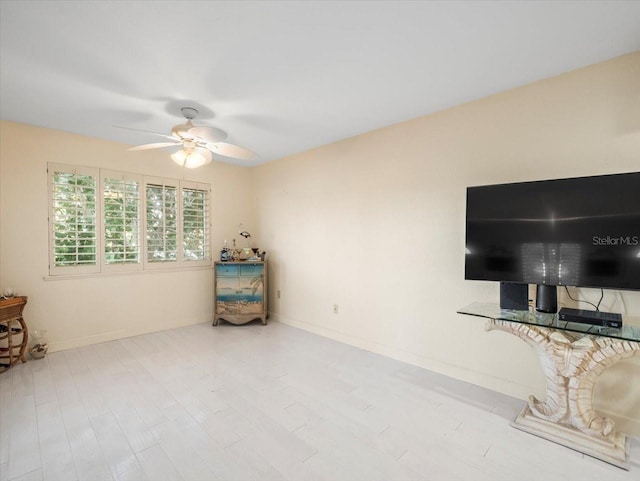 interior space with light wood-type flooring and ceiling fan