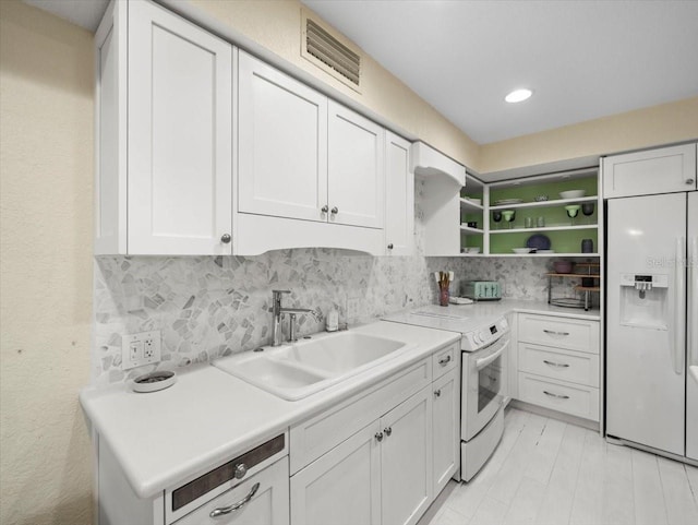 laundry area featuring cabinets and sink