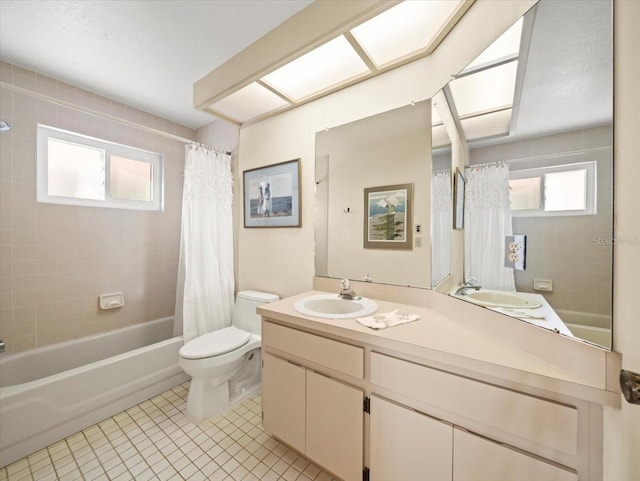 full bathroom with shower / bath combo with shower curtain, vanity, tile patterned floors, and toilet