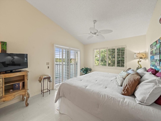 bedroom featuring a textured ceiling, vaulted ceiling, access to exterior, and ceiling fan