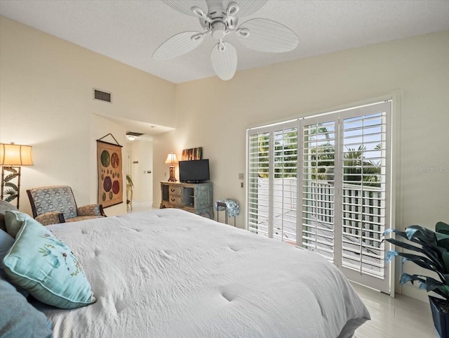 tiled bedroom featuring access to outside and ceiling fan