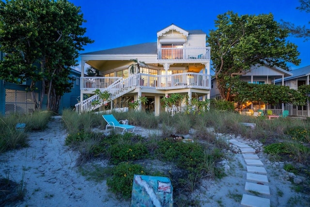 back house at night with a wooden deck