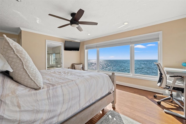 bedroom with ceiling fan, ornamental molding, a textured ceiling, and light wood-type flooring