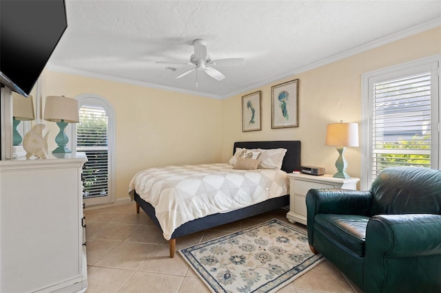 bedroom with crown molding, ceiling fan, a textured ceiling, and light tile patterned floors