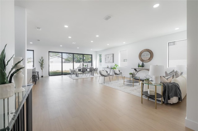 living room with light hardwood / wood-style floors