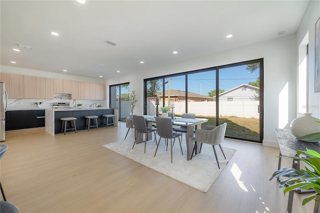 dining area featuring light hardwood / wood-style floors