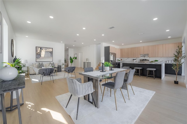 dining area featuring light hardwood / wood-style floors