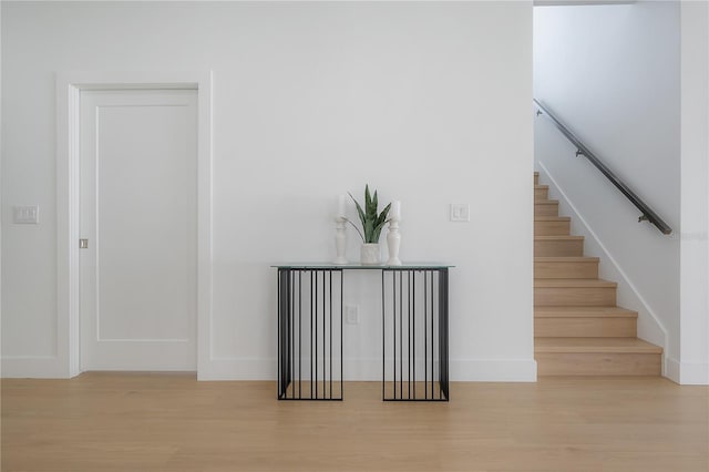 stairway featuring hardwood / wood-style floors