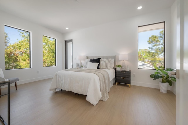 bedroom with light hardwood / wood-style floors