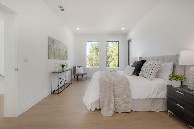 bedroom with light wood-type flooring