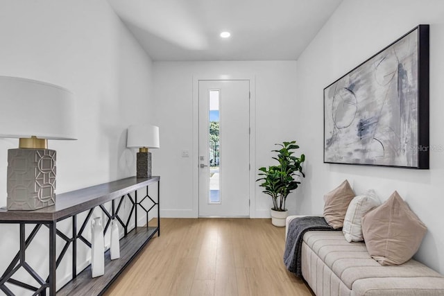 entryway featuring recessed lighting, wood finished floors, and baseboards