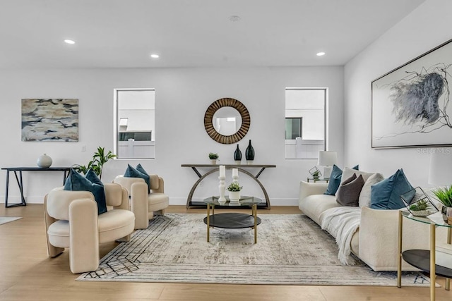 living room with recessed lighting and wood finished floors