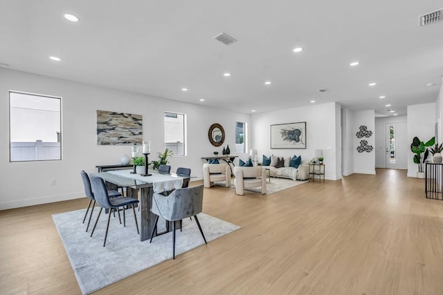 dining room with recessed lighting, visible vents, plenty of natural light, and light wood-type flooring