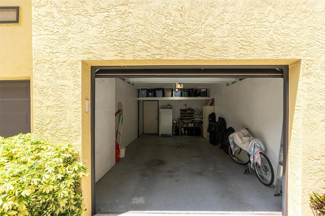 garage with white fridge