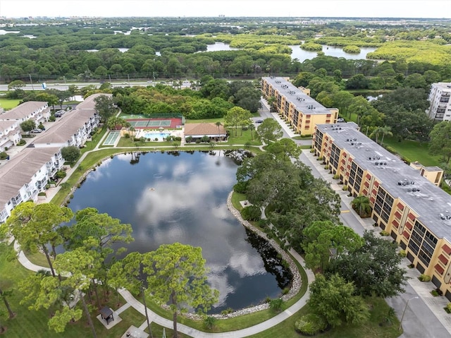 birds eye view of property with a water view