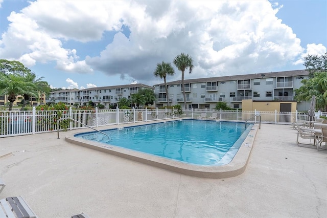 view of swimming pool with a patio area