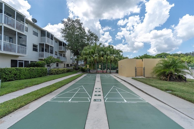 view of property's community featuring a yard