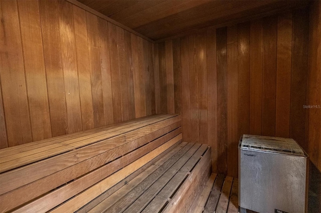 view of sauna / steam room featuring wood walls