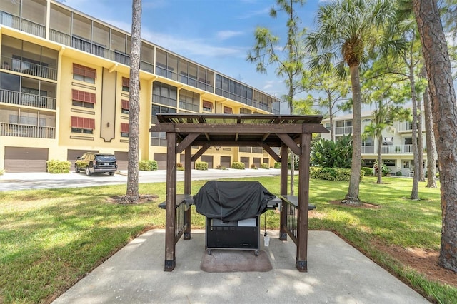 view of patio with a balcony and area for grilling