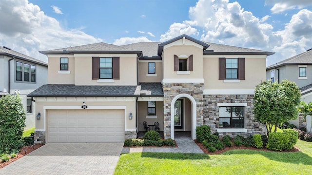 view of front of house with a garage and a front yard