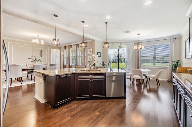 kitchen with an inviting chandelier, decorative light fixtures, dark brown cabinets, dishwasher, and an island with sink